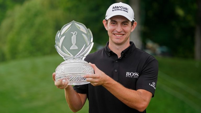 Patrick Cantlay holds the trophy after winning the Memorial golf tournament, Sunday, June 6, 2021, in Dublin, Ohio. (Darron Cummings/AP)