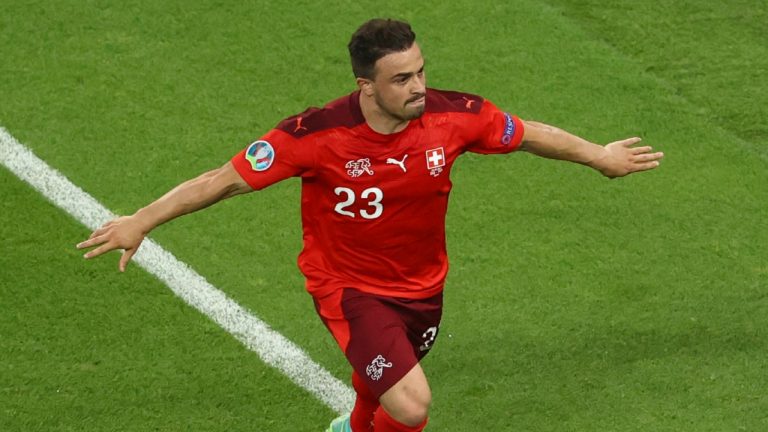 Switzerland's Xherdan Shaqiri celebrates after scoring his side's third goal during a Euro 2020 match against Turkey. (Naomi Baker/Pool via AP)