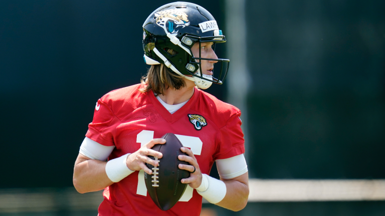 Jacksonville Jaguars quarterback Trevor Lawrence looks for a receiver during NFL football practice, Thursday, May 27, 2021, in Jacksonville, Fla. (John Raoux / AP) 