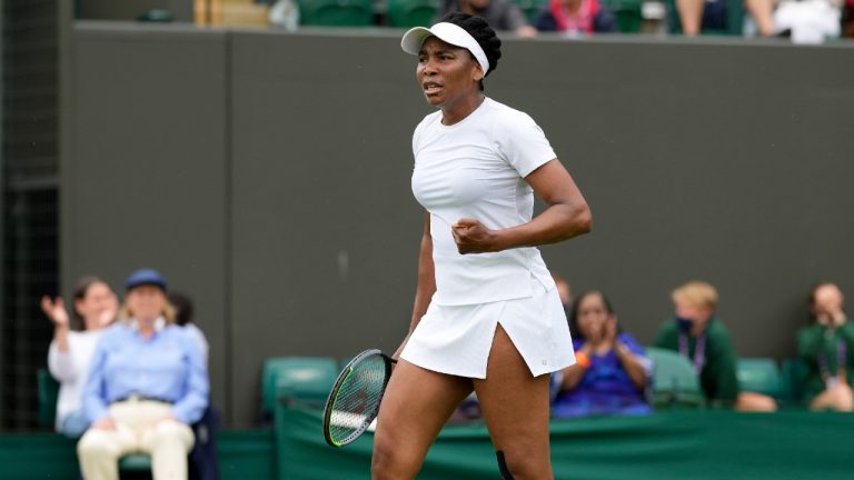 Venus Williams of the US wins the women's singles first round match against Romania's Mihaela Buzarnescu on day two of the Wimbledon Tennis Championships in London, Tuesday June 29, 2021. (AP)