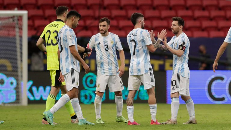 Argentina's players greet each other at the end of a Copa America soccer match against Paraguay at the National stadium. (Eraldo Peres/AP)