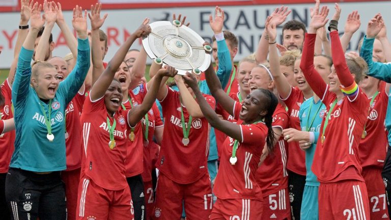 The players and team members from FC Bayern Munich women soccer team celebrate after winning the German women Bundesliga championship in Munich, Germany, Sunday, June 6, 2021. (Peter Kneffel/dpa via AP)