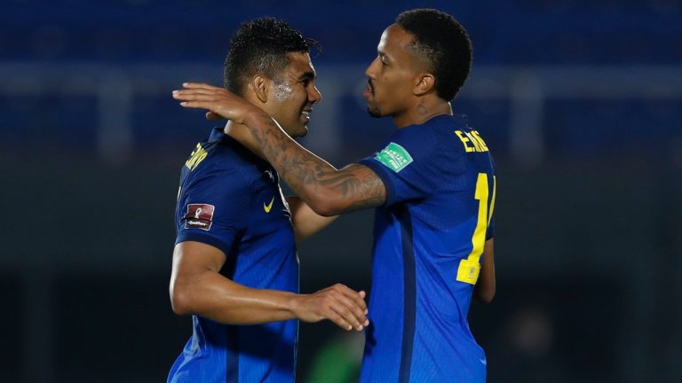 Brazil's Casemiro, left, and Eder Militao celebrate their team's 2-0 victory over Paraguay at the end of a qualifying soccer match for the FIFA World Cup Qatar 2022 at Defensores del Chaco stadium in Asuncion, Paraguay, Tuesday, June 8, 2021. (Jorge Saenz/AP)