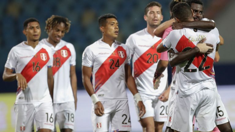 Players of Peru celebrate their team's 2-1 victory over Colombia during a Copa America soccer match at Olimpico stadium in Goiania, Brazil, Sunday, June 20, 2021. (Eraldo Peres/AP)