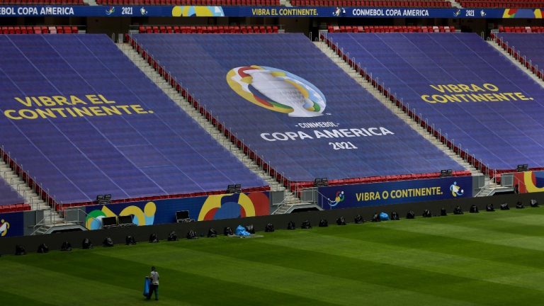 Employees prepare the National Stadium for the Copa America soccer tournament in Brasilia, Brazil, Friday, June 11, 2021. The stadium will host the opening game on June 13. (Eraldo Peres/AP)