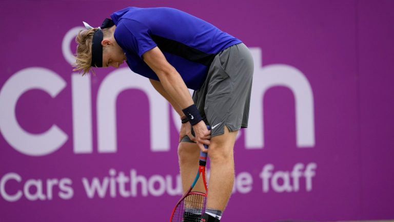 Denis Shapovalov of Canada reacts after he plays a return to Cameron Norrie of Britain during their semifinal singles tennis match at the Queen's Club tournament in London, Saturday, June 19, 2021. (Kirsty Wigglesworth/AP)