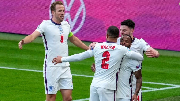 England's Raheem Sterling, second right, is congratulated by teammates Declan Rice, right, and Kyle Walker and Harry Kane, left, after scoring his team's first goal during the Euro 2020 soccer championship group D match between the Czech Republic and England at Wembley stadium, London, Tuesday, June 22, 2021.(Matt Dunham/AP) 