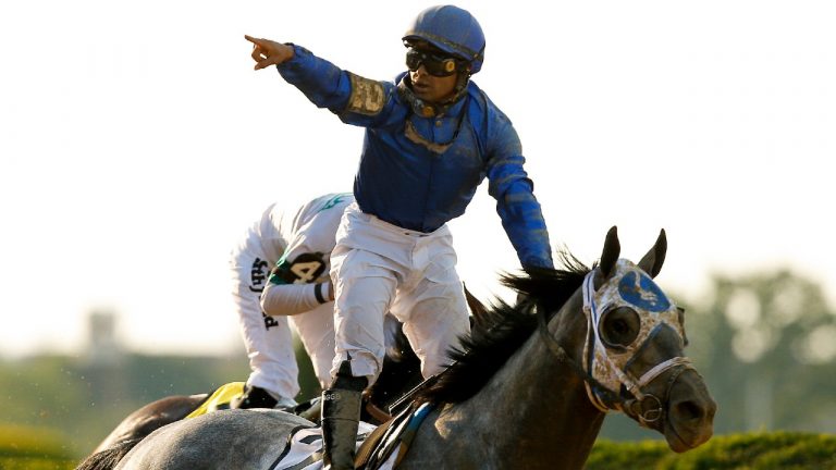 Jockey Luis Saez reacts after crossing the finish line atop Essential Quality (2) to win the 153rd running of the Belmont Stakes horse race, Saturday, June 5, 2021, At Belmont Park in Elmont, N.Y. (Eduardo Munoz Alvarez/AP) 
