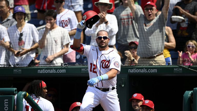 Washington Nationals' Kyle Schwarber takes a curtain call after he hit a two-run home run against the New York Mets on June 20, 2021, in Washington. (AP Photo/Nick Wass)