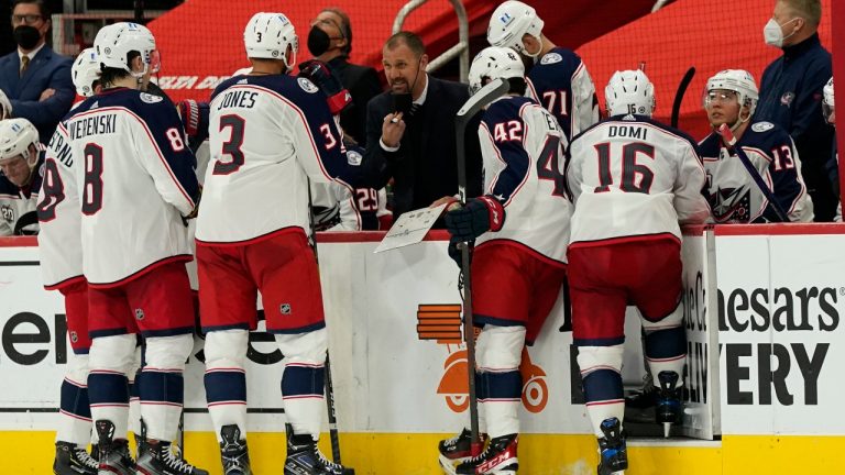 Columbus Blue Jackets assistant coach Brad Larsen talks to the team during the third period of an NHL hockey game against the Detroit Red Wings, Saturday, March 27, 2021, in Detroit. (Carlos Osorio/AP)