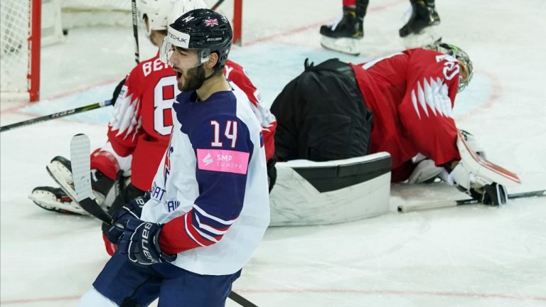 Liam Kirk of Britain celebrates a goal against Reto Berra of Switzerland during the Ice Hockey World Championship group A match between Switzerland and Britain at the Olympic Sports Center in Riga, Latvia, Tuesday, June 1, 2021. (Roman Koksarov/AP)