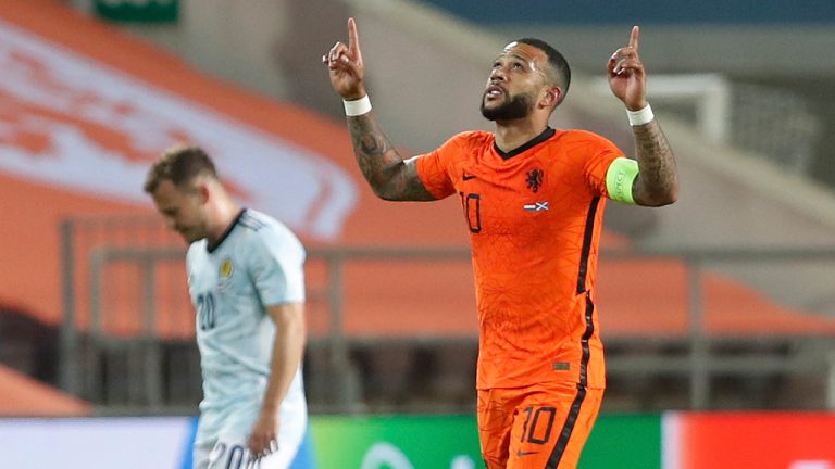 Netherlands' Memphis Depay, celebrates after scoring his side's second goal during the international friendly soccer match between the Netherlands and Scotland at the Algarve stadium outside Faro, Portugal, Wednesday June 2, 2021. (Miguel Morenatti/AP) 