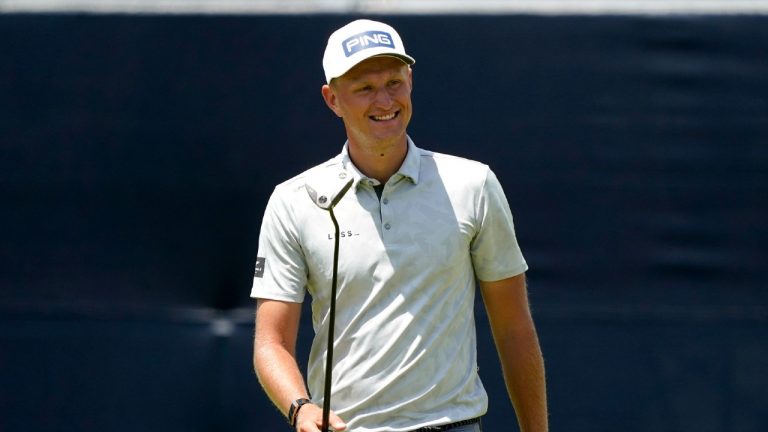 Adrian Meronk, of Poland, smiles after his putt on the 18th green during a practice round of the U.S. Open Golf Championship, Tuesday, June 15, 2021, at Torrey Pines Golf Course in San Diego. (Marcio Jose Sanchez/AP) 