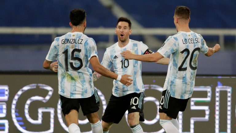 Argentina's Lionel Messi, center, celebrates scoring his side's opening goal against Chile during a Copa America soccer match at the Nilton Santos stadium in Rio de Janeiro. (Silvia Izquierdo/AP) 