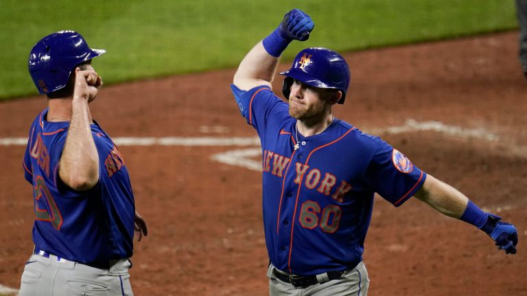 New York Mets' Billy McKinney (60) is greeted by Pete Alonso, left, near home plate after hitting a three-run home run off Baltimore Orioles relief pitcher Mac Sceroler during the ninth inning of a baseball game. (Julio Cortez/AP) 