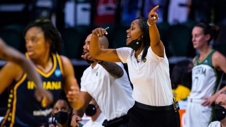 Seattle Storm coach Noelle Quinn, right, gestures to players during her debut as coach in the WNBA basketball team's game against the Indiana Fever on Tuesday, June 1, 2021, in Everett, Wash. Dan Hughes recently retired as coacch. (Dean Rutz/The Seattle Times via AP)
