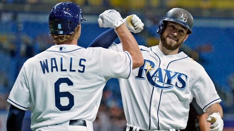 Tampa Bay Rays' Brandon Lowe celebrates his two-run home run off Baltimore Orioles starting pitcher Keegan Akin with Taylor Walls (6) during the fourth inning of a baseball game Friday, June 11, 2021, in St. Petersburg, Fla. (Chris O'Meara/AP)
