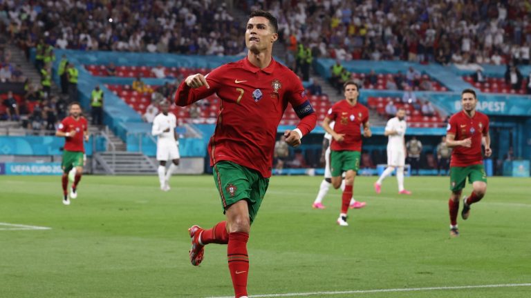 Portugal's Cristiano Ronaldo celebrates after scoring his side's second goal during the Euro 2020 soccer championship group F match between Portugal and France at the Puskas Arena in Budapest, Wednesday, June 23, 2021. (Bernadett Szabo, Pool photo via AP)