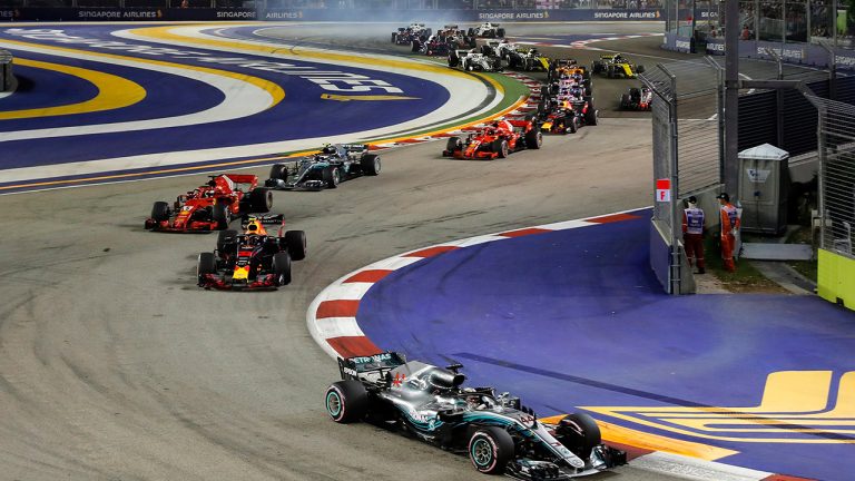 Mercedes driver Lewis Hamilton of Britain leads the field into turn three at the start of the Formula One Grand Prix of Singapore at Marina Bay Street Circuit in Singapore, Sunday, Sept. 16, 2018. (Vincent Thian/AP) 