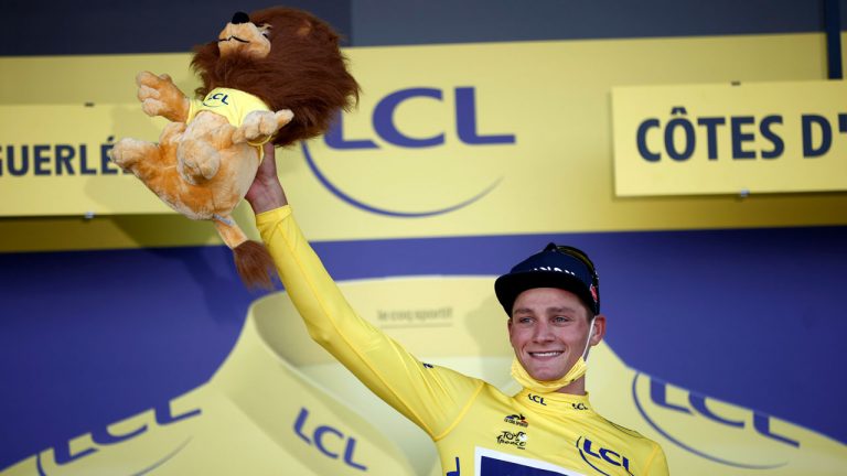 Nertherland's Mathieu Van Der Poel wears the yellow jersey of the overall leader on the podium after the second stage of the Tour de France. (Stephane Mahe/AP)
