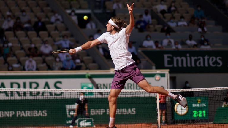 Stefanos Tsitsipas of Greece returns the ball to Germany's Alexander Zverev during their semifinal match of the French Open tennis tournament at the Roland Garros stadium Friday, June 11, 2021 in Paris. (Christophe Ena/AP)