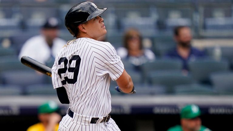 New York Yankees' Gio Urshela hits a go-ahead solo home run off Oakland Athletics relief pitcher Jesus Luzardo in the eighth inning of a baseball game. (John Minchillo/AP) 