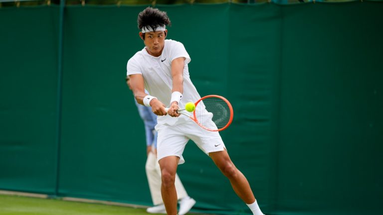 China's Ze Zhang plays a return to Antoine Hoang of France during the men's singles first round match on day two of the Wimbledon Tennis Championships in London, Tuesday June 29, 2021. (Alastair Grant/AP)