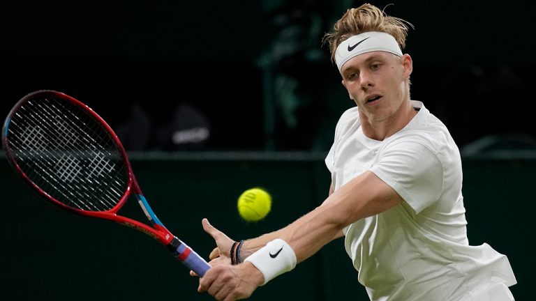 Canada's Denis Shapovalov plays a return to Britain's Andy Murray during the men's singles third round match against on day five of the Wimbledon Tennis Championships in London, Friday July 2, 2021. (Kirsty Wigglesworth/AP)
