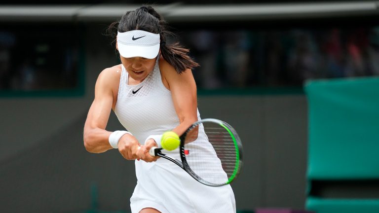 Britain's Emma Raducanu plays a return to Romania's Sorana Cirstea during the women's singles third round match on day six of the Wimbledon Tennis Championships in London, Saturday July 3, 2021. (Alberto Pezzali/AP)