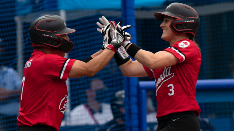 Canada’s Jennifer Salling, left, congratulates teammate Erika Polidori after they crossed the plate to score in the second inning against Mexico in the bronze medal game during the Tokyo Olympics, in Tokyo, Tuesday, July 27, 2021. (Adrian Wyld/CP)