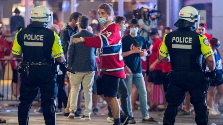 Canadiens fans disperse after police deployed a chemical irritant outside the Bell Centre following Game 4 of the Stanley Cup Final. (Graham Hughes/CP)