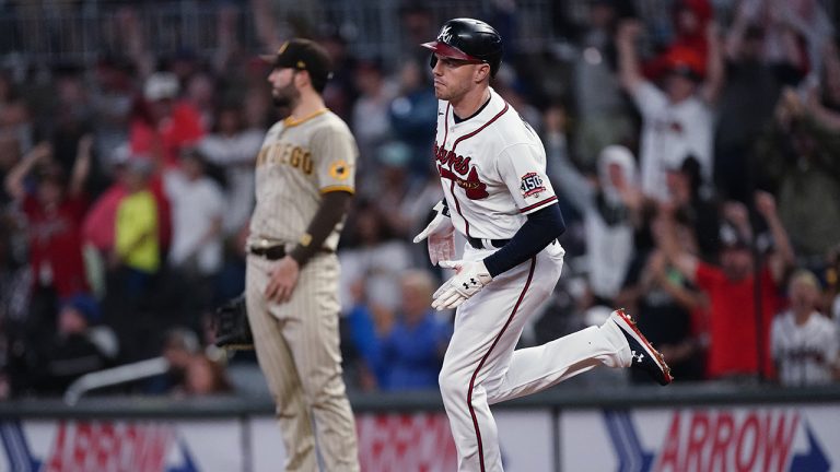 Atlanta Braves' Freddie Freeman (5) runs past San Diego Padres first baseman Eric Hosmer (30) after hitting a home run during the sixth inning of a baseball game Tuesday, July 20, 2021. (John Bazemore/AP)
