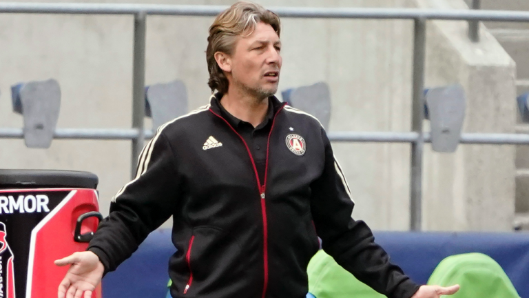 In this May 23, 2021, file photo, Atlanta United head coach Gabriel Heinze gestures from the bench during the second half of an MLS soccer match against the Seattle Sounders in Seattle. Atlanta United's disappointing 2021 record has cost Heinze his job. Atlanta United fired Heinze on Sunday, July 18, 2021. (Ted S. Warren / AP)
