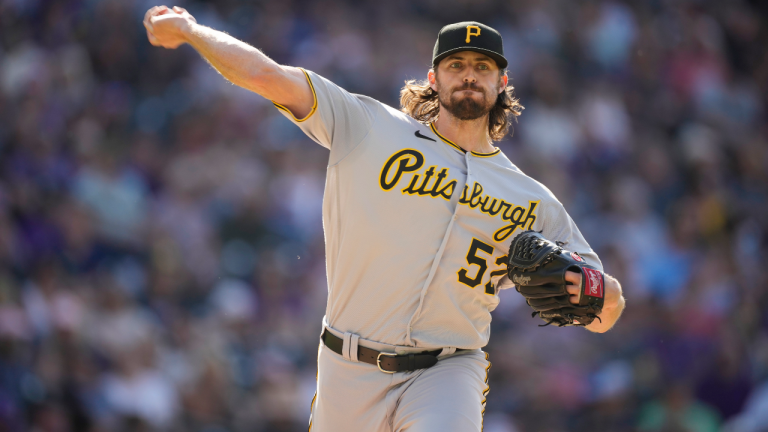 Pittsburgh Pirates relief pitcher Clay Holmes turns to make a pickoff throw against the Colorado Rockies in the sixth inning of a baseball game Monday, June 28, 2021, in Denver. (David Zalubowski / AP) 
