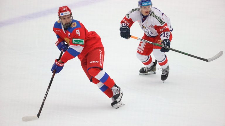 In this Feb. 14, 2021, file photo, Russia's Nikita Chibrikov, left, is chased by Petr Kodytek of the Czech Republic during a Euro Hockey Tour match in Malmo, Sweden. (Andreas Hillergren/TT via AP)
