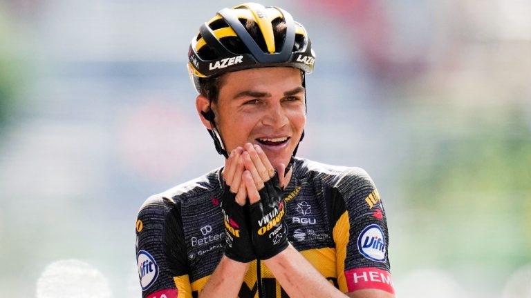 Sepp Kuss of the US celebrates as he crosses the finish line to win the fifteenth stage of the Tour de France cycling race over 191.3 kilometers (118.9 miles) with start in Ceret and finish in Andorra-la-Vella, Andorra, Sunday, July 11, 2021. (Christophe Ena/AP)