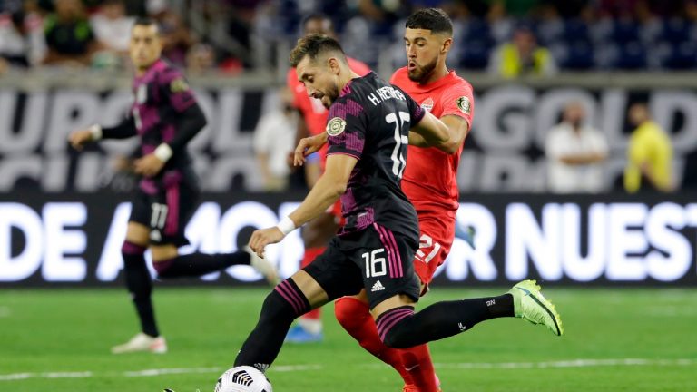 Mexico midfielder Hector Herrera (16) moves the ball past Canada midfielder Jonathan Osorio (21). (Michael Wyke/AP)
