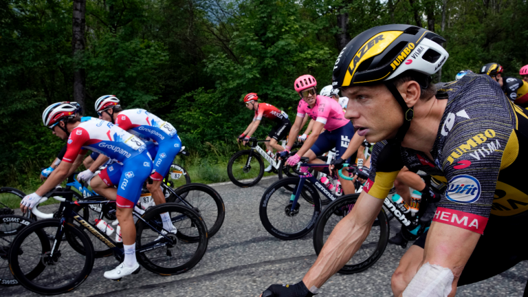 German Tony Martin, right, rides with the pack during the tenth stage of the Tour de France cycling race over 190.7 kilometers (118.5 miles) with start in Albertville and finish in Valence, France, Tuesday, July 6, 2021. (Christophe Ena / AP)