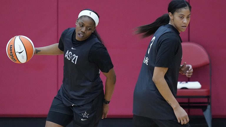Arike Ogunbowale drives around Candace Parker during practice for the WNBA All-Star team on July 13, 2021, in Las Vegas. (AP Photo/John Locher)