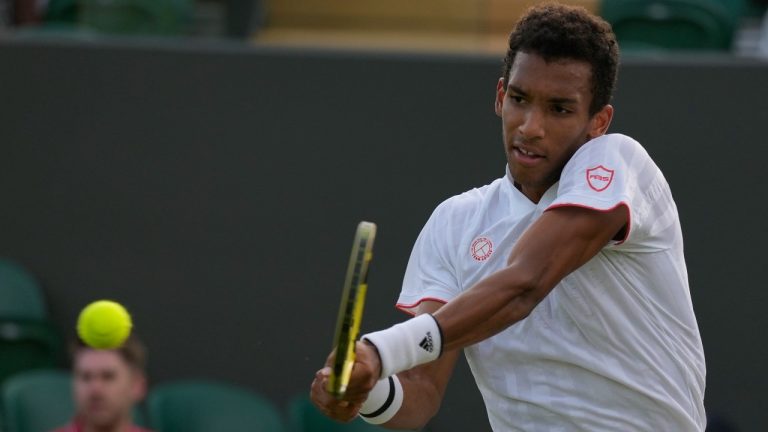 Canada's Felix Auger-Aliassime plays a return to Sweden's Mikael Ymer during the men's singles second round match on day four of the Wimbledon Tennis Championships in London, Thursday July 1, 2021. (Kirsty Wigglesworth/AP)