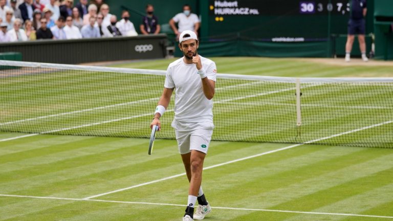 Italy's Matteo Berrettini celebrates winning a game against Poland's Hubert Hurkacz during the men's singles semifinals match on day eleven of the Wimbledon Tennis Championships in London, Friday, July 9, 2021. (Kirsty Wigglesworth/AP) 