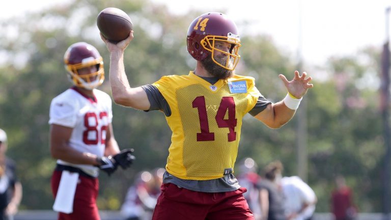 Washington Football Team quarterback Ryan Fitzpatrick (14) throws a pass during NFL football practice in Richmond, Va., Wednesday, July 28, 2021. (Ryan M. Kelly/AP)