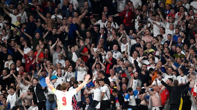England's Harry Kane celebrates with fans after winning the Euro 2020 semifinal between England and Denmark at Wembley Stadium in London, Wednesday, July 7, 2021. (Andy Rain/Pool via AP)