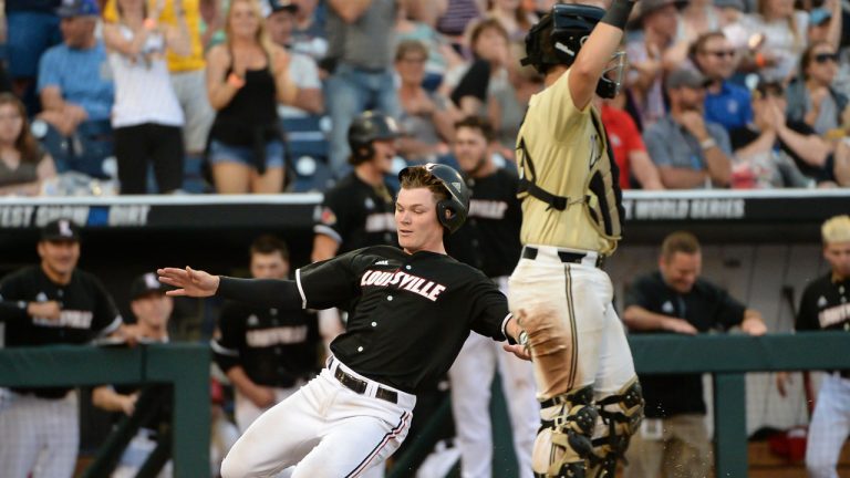 Louisville Cardinals catcher Henry Davis (32) scores a run. (Steven Branscombe/USA TODAY Sports)