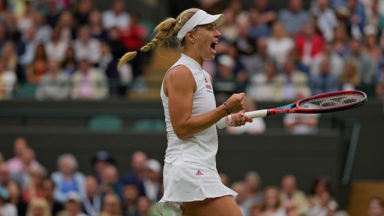 Germany's Angelique Kerber celebrates winning a game against Czech Republic's Karolina Muchova during the women's singles quarterfinals match on day eight of the Wimbledon Tennis Championships in London, Tuesday, July 6, 2021. (Alastair Grant/AP)