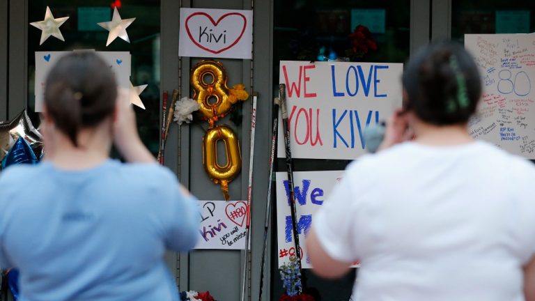 Columbus Blue Jackets fans visit a makeshift memorial in front of Nationwide Arena Monday, July 5, 2021, in Columbus, Ohio, to remember Blue Jackets goaltender Matiss Kivlenieks who died of chest trauma from an errant fireworks mortar blast in what authorities described Monday as a tragic accident on the Fourth of July. (Jay LaPrete/AP)