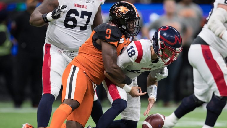 Montreal Alouettes quarterback Matthew Shiltz (18) is sacked by B.C. Lions' Shawn Lemon (9) and fumbles the ball leading to a turnover during the first half of a CFL football game in Vancouver, on Saturday September 28, 2019. (Darryl Dyck/CP)