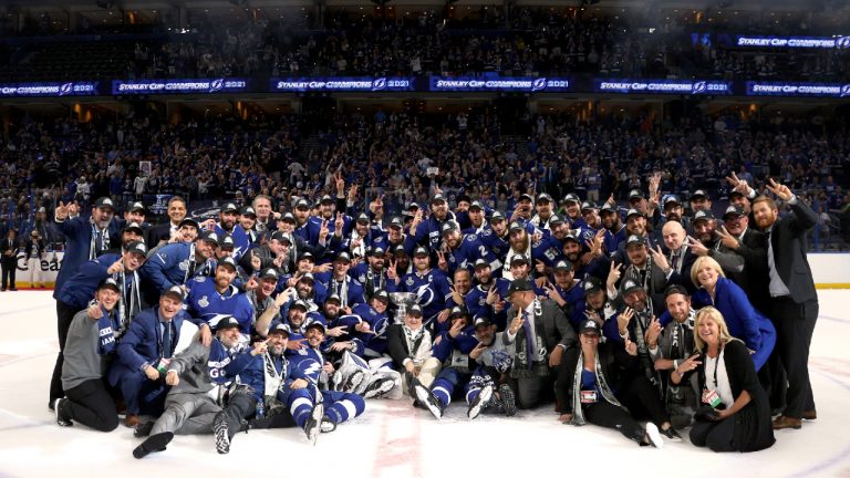 Tampa Bay Lightning players and staff celebrate winning the Stanley Cup. (Florence Labelle/NHL via Getty Images)