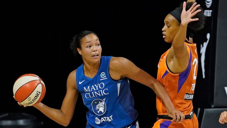 Minnesota Lynx forward Napheesa Collier (24) passes around Phoenix Mercury forward Brianna Turner (21) during the first half of a WNBA playoff basketball game Thursday, Sept. 17, 2020, in Bradenton, Fla. (Chris O'Meara/AP)