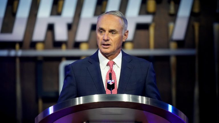MLB Commissioner Rob Manfred kicks off the first round of the 2021 MLB baseball draft, Sunday, July 11, 2021, in Denver. (David Zalubowski/AP) 